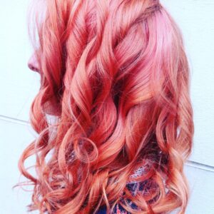coral pink waves and curls hair colour in clerkenwell london