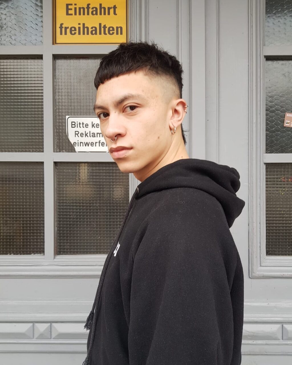 mullet short sides black hair berlin