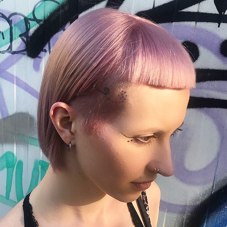 pink short bob with undercut hair colour