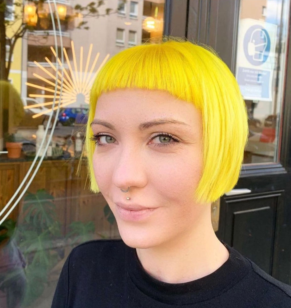 neon yellow hair colour with fringe bangs at ESHK Friseur Moabit Berlin