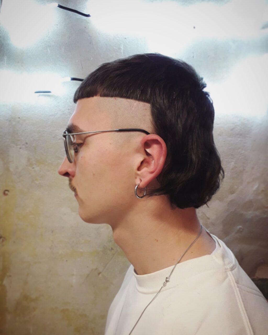 Sharp mullet haircut with shaved sides in Moabit, Berlin