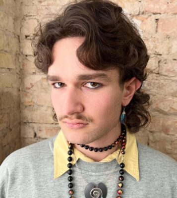 80s volume haircut with middle parting and mullet back at eshk hair salons berlin