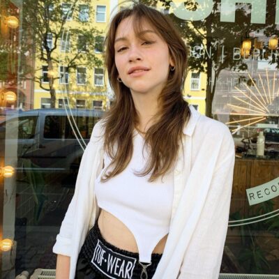 layered long haircut with middle parting brown hair at eshk friseur neukölln berlin