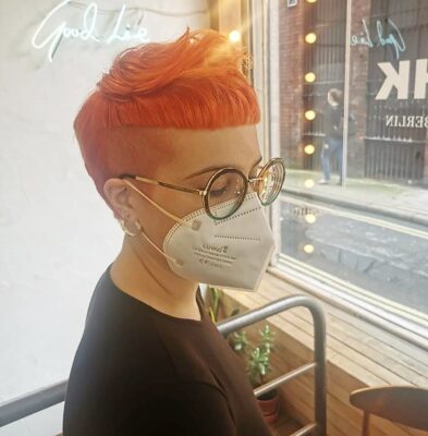 short bright orange shaved sides with fringe haircut at eshk hairdresser clerkenwell london