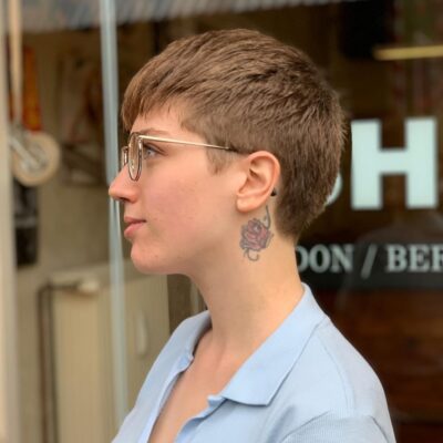short dark blonde haircut with side parting eshk hair salon neukölln