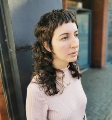 short fringe with long back mullet curls at eshk hairdresser clerkenwell london