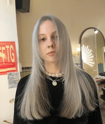 silver pearl hair color on long sleek hair with middle parting by Sophia ESHK Friseur Moabit Berlin